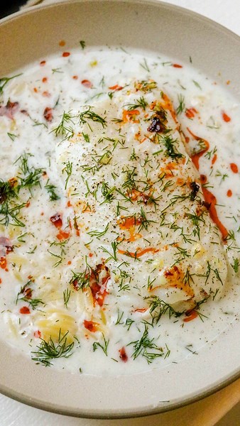 Emily Eggers on Instagram: "🐟🥥I shared this poached cod recipe over 7 months ago and it is still my most popular recipe by far! in case you (somehow) missed it, here it is again! it’s so simple and easy, but surprisingly full of flavor. to get the full recipe sent to your DMs, comment “RECIPE” or just check my recipes highlight on my profile for the link! and pls, ignore the christmas tree in the background. I filmed this in early January 🫠"