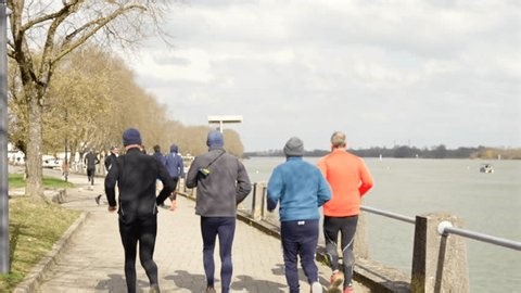 clip-3988741969-walkers-joggers-near-saone-river-macon-france