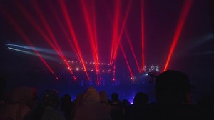 Vibrant Light Show with Crowd at Night
