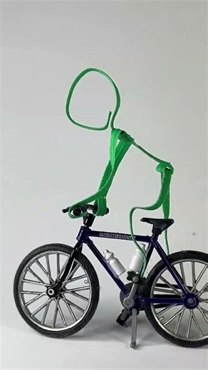 Green Guy Has X Games Dreams on a Real Bicycle | Miniature Twist Tie Art