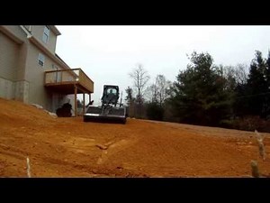 Bobcat with Landscape Rake on New Yard