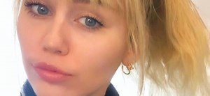 Miley Cyrus Rolling Down Bikini After Swim Is 'Girlfriend' Material