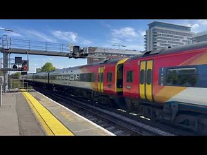 AN 8 CAR CLASS 158/159 IN THE ORIGINAL SWT LIVERY STORMS AWAY FROM BASINGSTOKE BOUND FOR LONDON