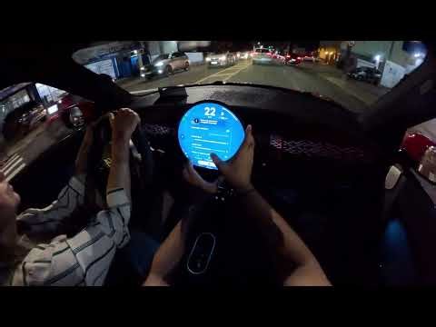 My mother driving an electric car for the first time.