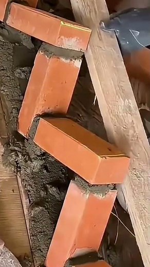 constructing walls by making triangular angles on the brickwork with the help of cement