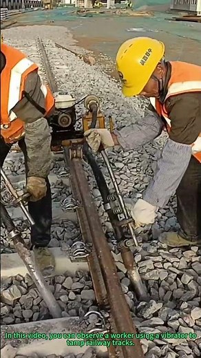 Railway Track Tamping: Worker Uses Vibrator to Secure Sleepers for Stable Train Operation