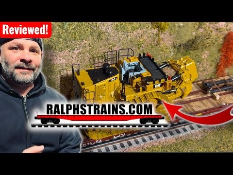 Model Trains Hauling Heavy Construction Gear.