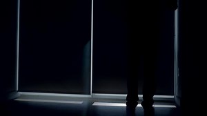 Young Successful Man Living in High Rise City Apartment With Skyline View