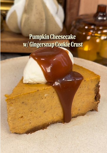 Pumpkin Cheesecake with Gingersnap Cookie Crust 🎃🧡😋 the most creamy pumpkin cheesecake paired with whipped cream and salted caramel sauce! The perfect fall dessert 🧡 For the gingersnap cookie crust: 8 oz. gingersnap cookies 3 tbsp. (40g) sugar ½ tsp. ground ginger ½ tsp. ground cinnamon ¼ tsp. ground cloves 6 tbsp. unsalted butter, melted For the pumpkin cheesecake filling: * 24 ounces (678g) cream cheese, room temperature * 170g light brown sugar * 100g granulated sugar * 2 tbsp cornstarch