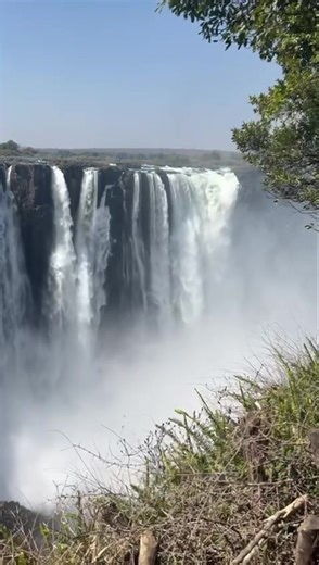 The falls are alive with a deafening roar as the rains replenish their mighty flow. Ready to experience this wonder? DM for help planning your visit! | Victoria Falls