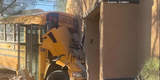 WATCH: School bus crashes into Tucson apartment complex