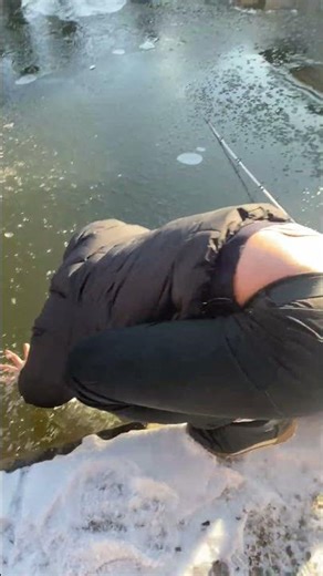 Man Trying To Grab Slippery Fish Falls Through Thin Ice || ViralHog
