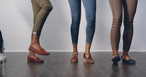 Legs, creative business people and dancing, team building or achievement in workplace, fun and energy. Feet, shoes and happy group with professional win, trust and support with success and about us