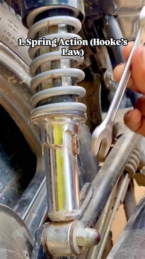Rkvisionacademy Jeeneet on Instagram: "1. Spring Action (Hooke’s Law) The visible coil is a helical compression spring. When the bike hits a bump, the wheel moves upward and compresses the spring. F=kxF = kxF=kx Where: FFF = restoring force kkk = spring constant (stiffness) xxx = compression ✔ More compression → more restoring force pushing the wheel back down. ✔ This supports the bike’s weight and rider. 🔹 2. Energy Storage and Release When compressed: PE=12kx2PE = \frac{1}{2}kx^2PE=21​kx2 Bum