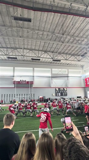 New Ohio State kicker Connor Hawkins makes a kick surrounded by students during Saturday's practice