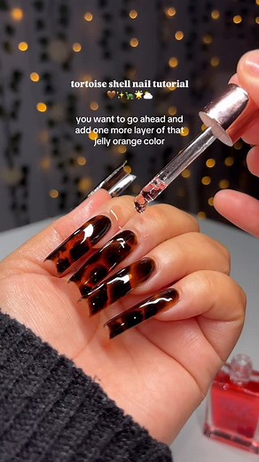 carmen m on Instagram: "easy tortoise shell nails ⛅️✨🤎 how to ⬇️ 1) one coat of orange jelly gel polish 2) THIN layer of blooming gel (DO NOT CURE) 3) use a dotting tool to blob on black gel polish and swirl 4) allow the black to bloom to your liking then fully cure 5) add another coat of the orange jelly gel polish products used 🎀 @nailzkatkat XXXL Square Tips (CARMZ30) Amazon products (on store front) •Senvenski Orange jelly gel •Beetles blooming gel •Gelixir black gel •Dotting tool •Disposa