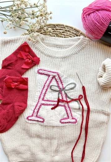 All week long leading up to New Years, I’ll be sharing your favorite reels of 2025 - Thank you for an absolutely incredible year!! ✨🪡 — Sweet Valentine’s Day DIY craft! I made this sweater for my friend’s baby.💕🎀❤️ These Bow Letter Patterns are in my Etsy shop - I also have this bow alphabet available as a digital download! Supplies can be found on my Amazon (link in my bio) Stitches Used: ✨ Chain Stitch Letter Outline ✨ Heavy Chain Stitch Fill ✨ Chain Stitch Bow ✨ Lazy Daisy & Straight Stitc