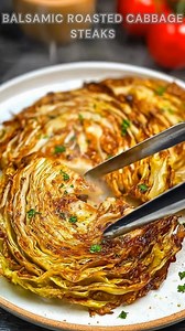 Cabbage sliced into thick steaks. Brush with balsamic, olive oil, garlic, and oregano. Roast at 400°F for 30 minutes. These cabbage steaks come out caramelized, tender in the center, and crispy on the edges with a tangy-sweet finish. Ingredients ➤ 1 head cabbage ➤ 3 tbsp olive oil ➤ 2 tbsp balsamic vinegar ➤ 1 tsp agave FULLL Recipe in First Cօʍʍеոτ 👇👇 | Nessy Recipes