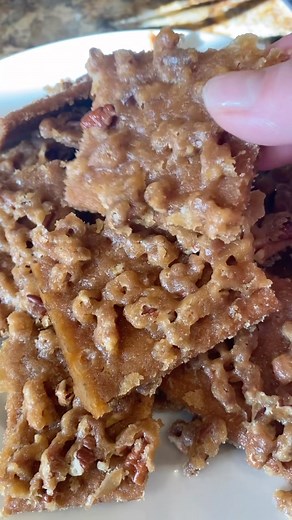 Amy Ammann Pawelek on Instagram: "Old school favorite!!! Easy Praline Toffee using Graham crackers!!! Be warned it is addictive!!! Screen shot recipe at the end of the reel and tag me if you try it!!! Enjoy!!! #companycoming #pralinetoffee #grahamcrackers #easyrecipes #sweet #delicious #yummy #foryou #sweetrecipes #food #partyideas #partyfood #pecans #holidayideas"