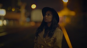 Professional Female Photographer Using DSLR Camera Capturing Photos