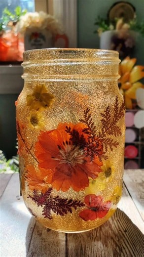 33K views · 436 reactions | Happy Friday!  Here's a quick video using dried flowers from Amazon & gold glitter to make a shimmery Fall Jar 李 Have a beautiful day y'all! #fallaesthetic #driedflowers #fallcrafts #falldecor #diyautumn #autumndiy #AutumnCrafts | Love Crafted Decor | Facebook