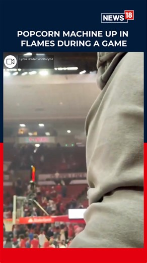 A fire that erupted from a popcorn machine caused a brief delay during a college basketball game between the Oklahoma Sooners and the Georgia Bulldogs on Saturday, February 14. Credit: Lydia Holder via Storyful #BasketballGame #Oklahoma #USA #Fire | News18