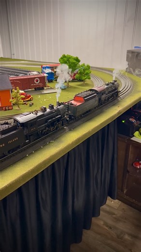 Gold Standard Trains on Instagram: "Me and the boys straightening up the layout and setting up some trains. Rare Saturday morning to get some hangout time in with them. We are anxious to get to next steps of the layout build and add that upper loop. But for now, we must wait. Getting them to agree on the best course of action is half the battle lol."