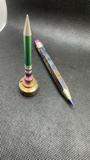 Uncle Sherb on Instagram: "Check THIS out. @taskrok @highlyeducatedti #SherbetCollab custom anodized #TiPencil. I’ve never seen anodizing with this much detail. A special piece for sure. Still works for signing glass. Also featured is a carb cap/pencil combo from way back. I had my producer make some shorties with threading on the eraser but never made it past the prototype. That one’s not for sale! 300 with moodmat and stickers included. DM to scoop #anodizedtitanium #highlyeducated #taskrok"
