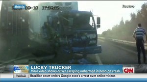 Watch trucker walk away from collision