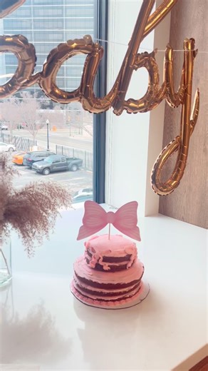 BeeLoved Sweet Treats on Instagram: "She’s stacked, sweet, and tied with a bow 🎀 My first tiered cookie cake!💗 The drive was nerve racking when transporting, but it made it without any trouble 🙏 #cookiecake #prettyinpink #tieredcookiecake"