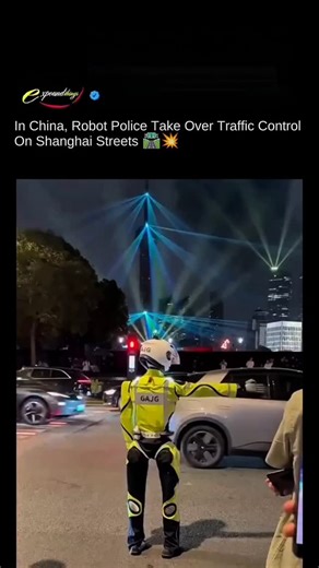 ex pounds on Instagram: "Robot police were spotted guiding traffic on Shanghai streets during a training drill. At a busy intersection in Huangpu District, a humanoid robot demonstrated basic traffic control gestures, stop, go straight, and turn, as part of China's experiment with Al-powered traffic management. The robot is still in the R&D phase and hasn't been officially deployed yet, but it offers a glimpse into the future of smart cities. Share your thoughts below! If you love learning follo
