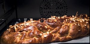 Baking of homemade traditional Czech Christmas braided cake - vanocka - with almonds and raisins in oven. Time lapse video Stock Video