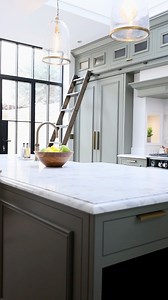 We love the blend of functionality with aesthetics in our Fulham project. The library ladders here not only make for a beautiful design feature, they also allow access to the overhead cabinetry. Often upper cabinetry can be wasted space as it’s too hard to reach, but these ladders solve that problem. The upper cabinets have reeded glass fronts too, which builds into the character of this design. Would you consider library ladders in your own kitchen design? They will certainly be a talking point