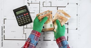 Worker counts money for building on calculator over floor plan drawing upper view. Engineer checks payment on printout of house apartment