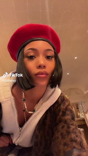 Stylish Indoor Fashion: Red Beret and Leopard Coat