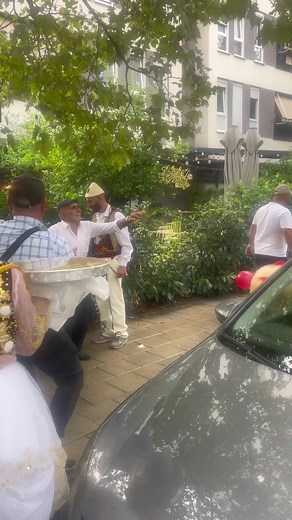 Cultural Celebration in Urban Setting with Music and Costumes