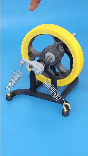 Flywheel Regenerating Energy From Spring Mechanism
