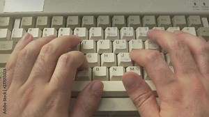 typing on an old retro computer keyboard