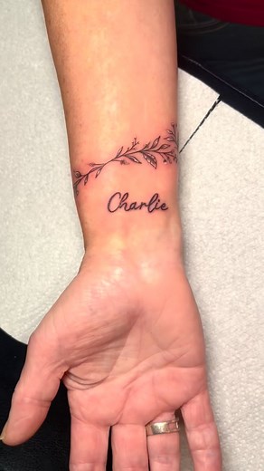 Pretty flower bracelet and script for this lady in love by trini @inkvinetattoos 🌸 #love #tattoos #tattoo #tattoostyle #tattooed #tattoooftheday #ink #flowertattoo #bracelet #bracelettattoo #scripttattoo #script #nametattoo #customtattoo #prettytattoo #girlytattoo #tattoolife | Trini Seabrook