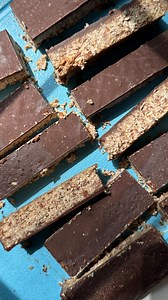 Leftover Almond Pulp Bars 🍫 Gonna be honest, I was just eyeball measuring. But if you want to try it this is about what I did 🫶 -10oz bag almonds that have been soaked and processed (or ~3 cups bagged almond flour) -1/2 cup melted coconut butter -1/2 cup peanut butter (any nut butter will do) -2 tbsp olive oil -1/4 cup flaxseed meal -1 cup unsweetened shredded coconut -1/4 cup maple syrup -1/2 cup chocolate chips -1/4 cup coconut oil Melt coconut butter and peanut together. Combine almond pulp