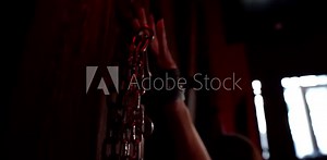 handcuffed woman during bdsm sex play, closeup of hand fixing by chain in dark room