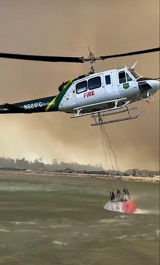 Helicopter loading the Bambi Bucket. #forestfire #wildfire #aviation #helicopter #firefighter