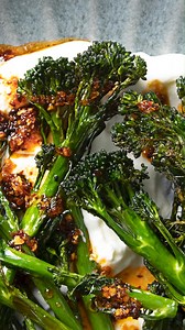 Try our 2 ways with Tenderstem® broccoli! 🥦 Both made in the air fryer 😁 Which recipe are you making first? Difficulty: Easy Serves: 2–3 Prep time: 5 minutes Cooking time: 15 minutes 📌 INGREDIENTS 2 x 230 g Woolworths Tenderstem® Broccoli 4 T olive oil Sea salt and freshly ground black pepper, to taste 60 g flour 2 T water 2 free-range eggs 60 g Woolworths Asian Panko Breadcrumbs 1 cup Woolworths Labneh Medium Fat Soft Cheese 2 T Woolworths Onion Chilli Crunch 3 T Woolworths Maple Syrup ½ cup