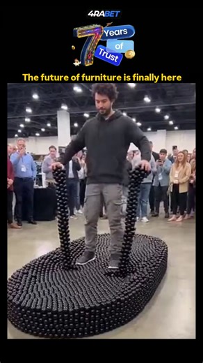 Making Cartoons on Instagram: "The post showcases a 10-second video of a man rapidly assembling and testing a modular chair from black interlocking blocks at a convention, highlighting quick reconfiguration for versatile seating. - This demonstrates EverBlock Systems' real-world product, using recyclable plastic blocks for sustainable, customizable furniture that reduces waste compared to traditional manufacturing, as per their site data on 90% material reuse. - With 13 million views and mixed r