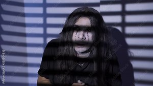 The cowardly and nervous emo teenager. The teenager with the emo lifestyle looks confused and agitated.