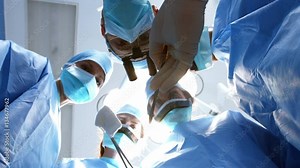 Surgeons performing operation in operation room at the hospital 4k