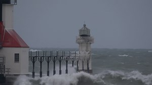 Huge Waves Slam Frozen Lighthouse as Frigid Weather Takes Hold