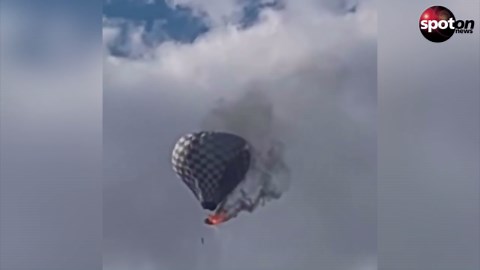 Hot air balloon burns down in flight - one dead
