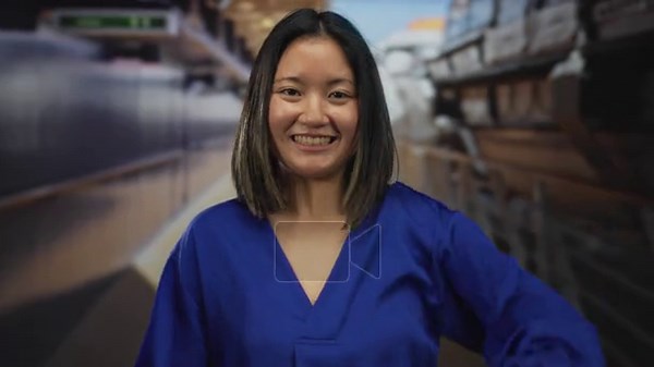 Woman smiling and playfully covering her eyes while enjoying a relaxing moment on a cruise deck, wearing a vibrant blue blouse against a nautical backdrop Stock Video Footage - Alamy