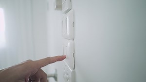 Download Concept save energy save the world .Men are turn off the switch light when not in use. Turning off energy help for saves energy and reduces global warming. for free